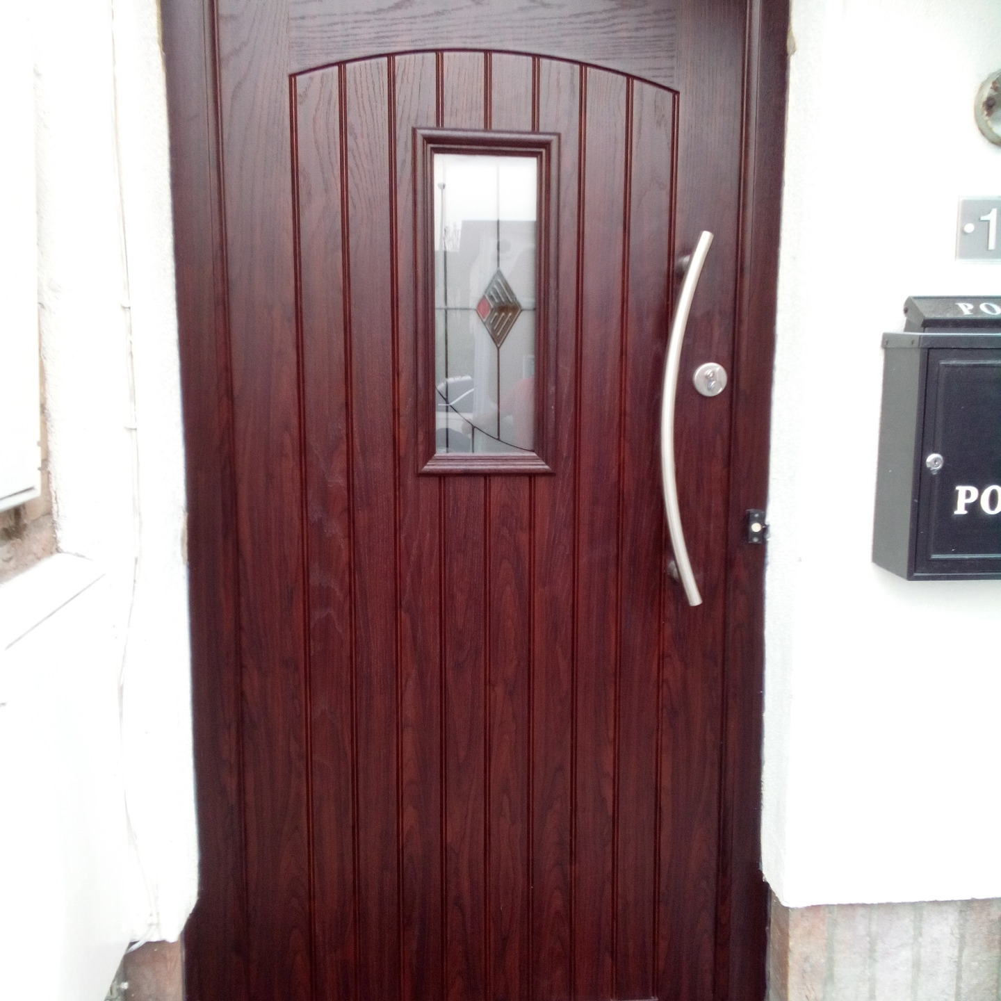 Composite Door in Rosewood. With Slam Lock and Curved stainless steel Handle.  Balbriggan Co Dublin